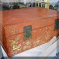 D11. Chinese trunk with red covering and gold decoration. 